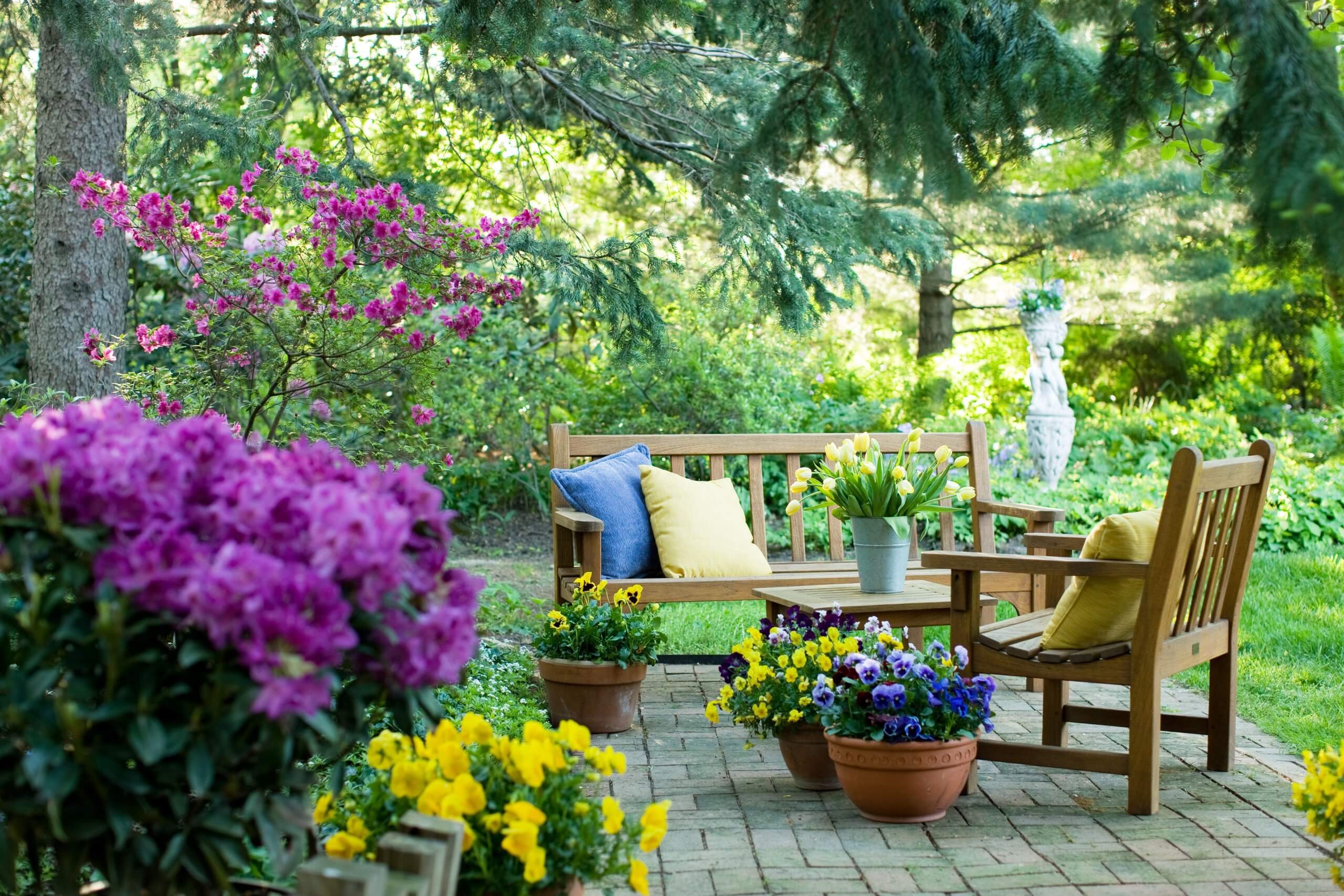 Tidy garden seating area with flowers