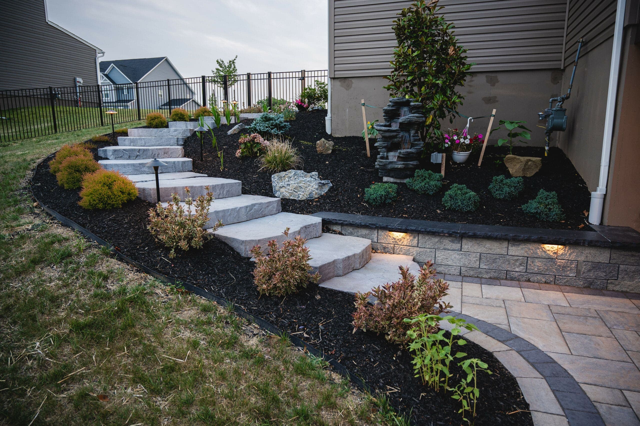 Landscaped stone steps with evening lighting